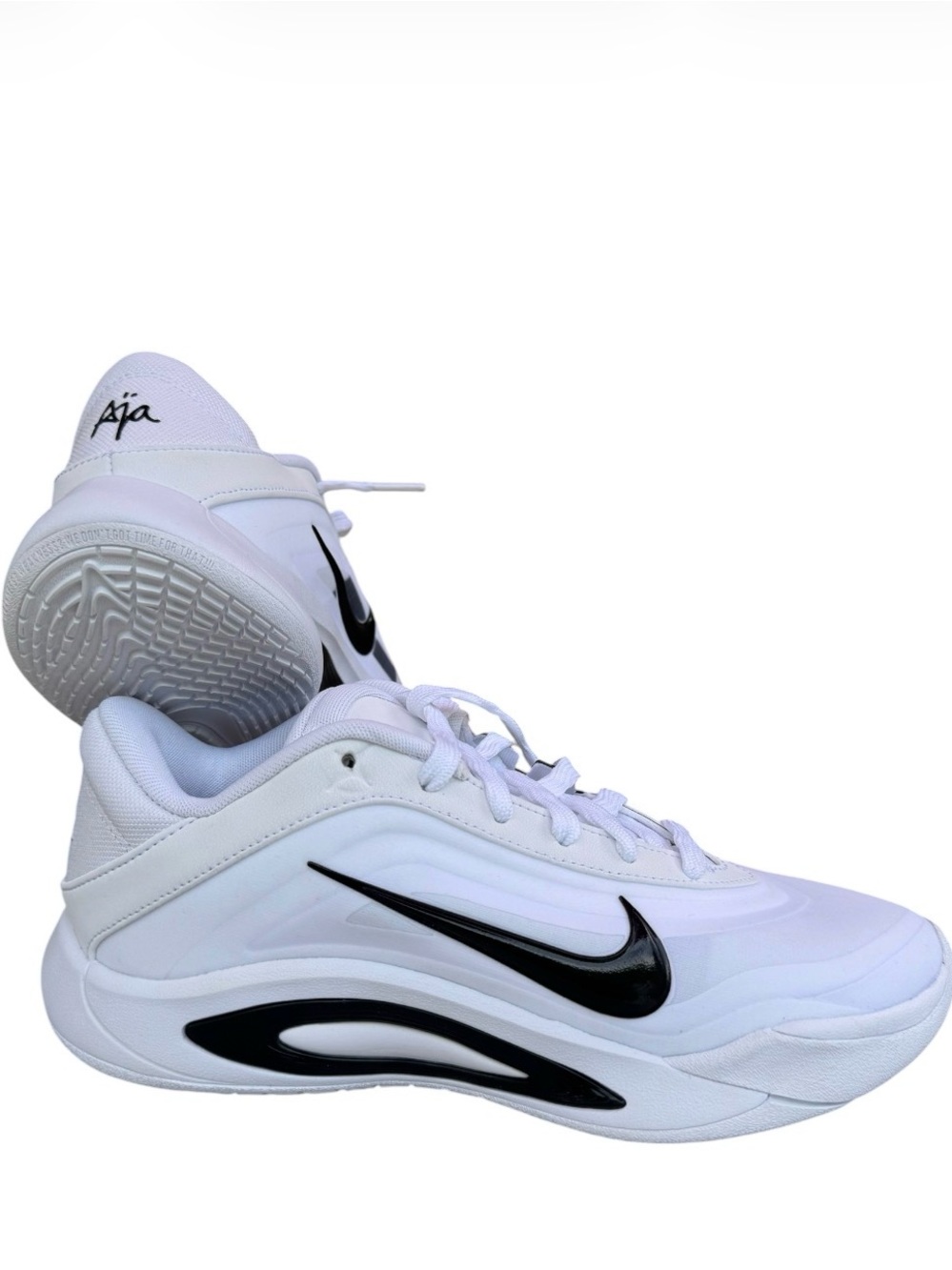 Nike White Sneakers with Black Swoosh Accent